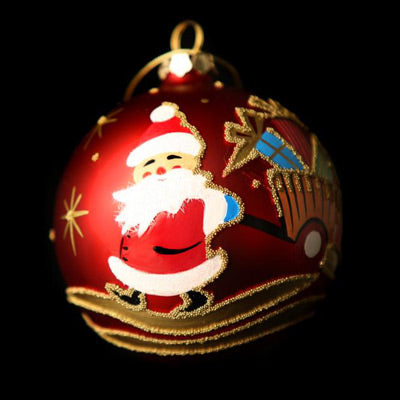 red 100mm bauble with santa pushing a trolley full of presents